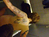 German tattooed girl fuckin in public changing room!!