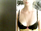 Dressing room hidden cam - Topless brunette with nice boobs